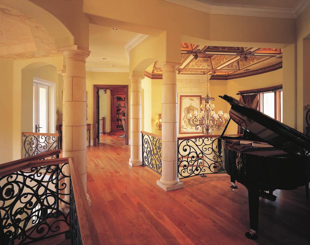 A piano loft above the grand parlor and the dining room serves as a bridge to connect several areas on the second floor.
