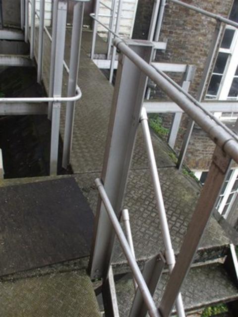 External Fire Escape at Rear: The handrails are not a