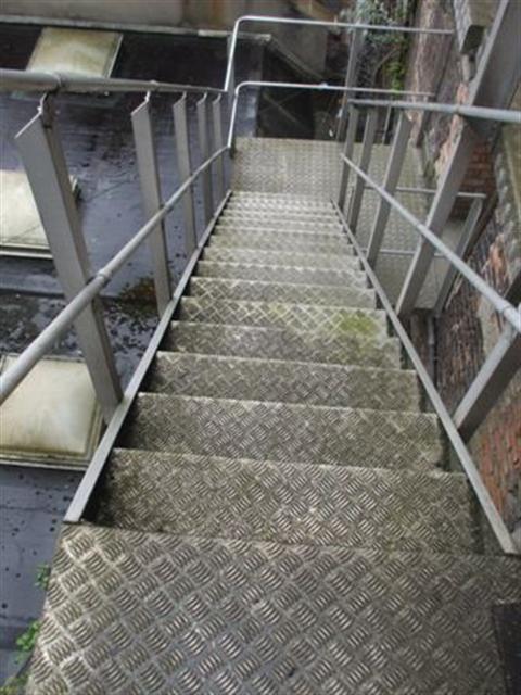 External Fire Escape at Rear: Some of the steps have a