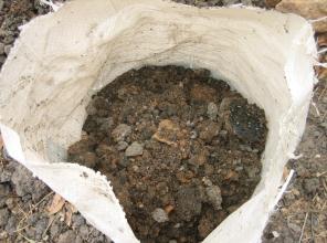 The extracted pit contents, mixed with soil, can also be bagged (in old cement bags for instance) at this stage,