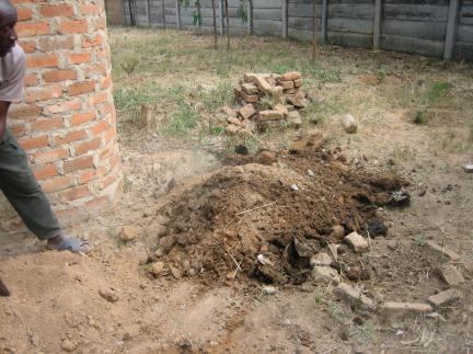 In this case the upper rim brickwork of the pit was removed and a new much larger pit dug and lined for a new toilet.