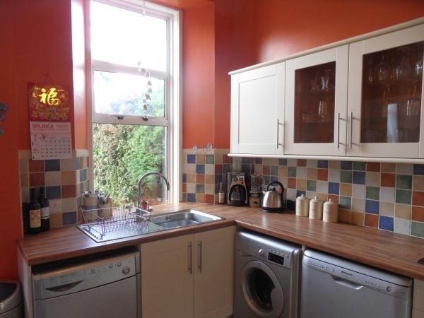 1m (10' 3) Spacious fully fitted kitchen with chrome sink and swan neck mixer tap, wide range of wall and base mounted storage units with