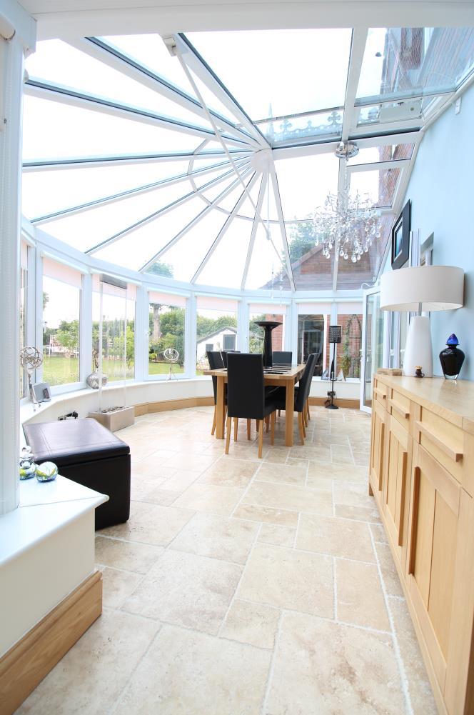 Page 6 Family Room 5.90m x 6.00m With 2 u.pvc double glazed French style doors that open to the rear garden.