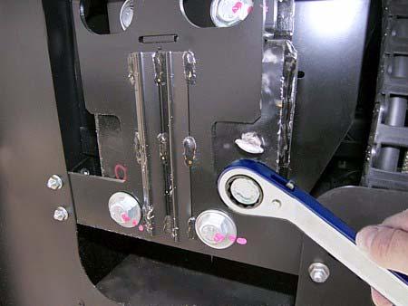Retract Bolts are located on the outboard mounting plates of the slideout room as shown. These plates are located at both ends of the room inside the StoreMore TM compartment doors.