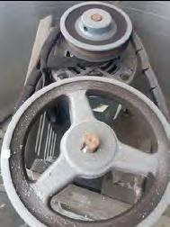 The fan belt on the large fan was discovered to be cracked and in poor condition as shown in Photo 13.