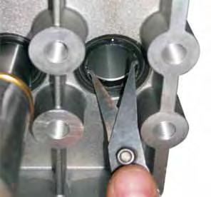 pliers. Make sure that the boring is not damaged when the oil seal rings are removed. 2 3 11.9.