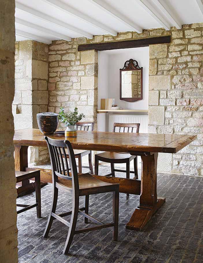 A set of wooden skittles suspended from the ceiling is not a centrepiece that you would expect to greet you upon arriving at a house in the Cotswolds Windrush Valley.