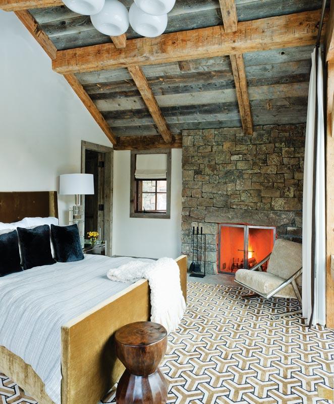 The use of regional materials was carried into the bath, where a stone wall and wood beams warm the space.