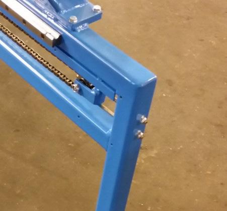 Tighten the screws that come out through the frame beam in the front of the machine.