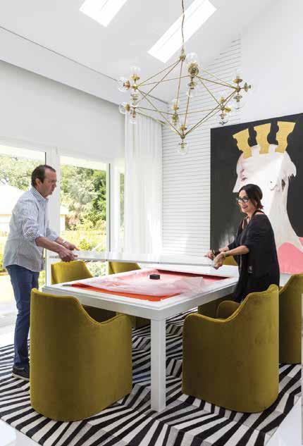 Chair by Vondom, bench by Cisco Brothers, photo of Steve McQueen from Villa Vici, light fixture custom by Solaria for Villa Vici.