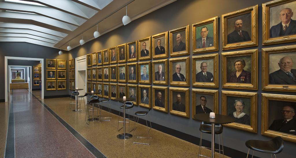 THE GALLERY CORRIDOR - YOUR GRAND WELCOME The Gallery Corridor runs alongside the suite of function rooms and is populated by portraits of men in smart suits and a small handful of women.