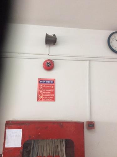 Replace the fire alarm system with a new, listed