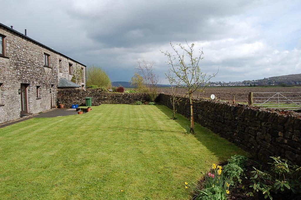 A superior and very spacious 4/5 bedroom conversion of a Lakeland stone and slate barn situated in a courtyard of similar properties within the National Park.