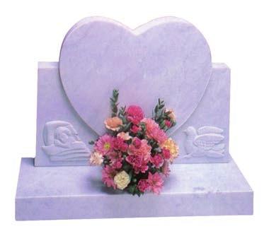 A shaped heart headstone with a hand carved design CM09 All Polished Blue Pearl Granite.