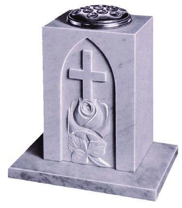 A vase with a hand carved rose and raised cross design.