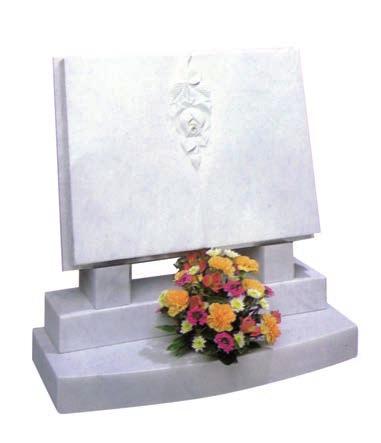 MH05 Marble. A book of life headstone with two carved dog roses in the panel. The base has a centre hole for a MH06 Marble.