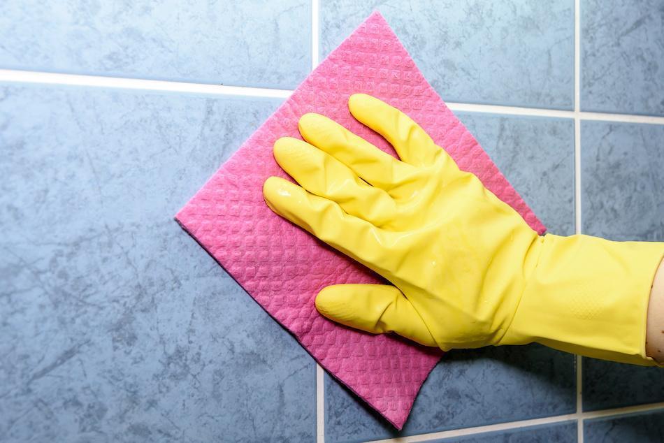 Make sure you take appropriate steps to protect yourself from breathing in airborne mold spores when scrubbing surfaces. Rubber gloves, breathing masks and even goggles can make the process safer.