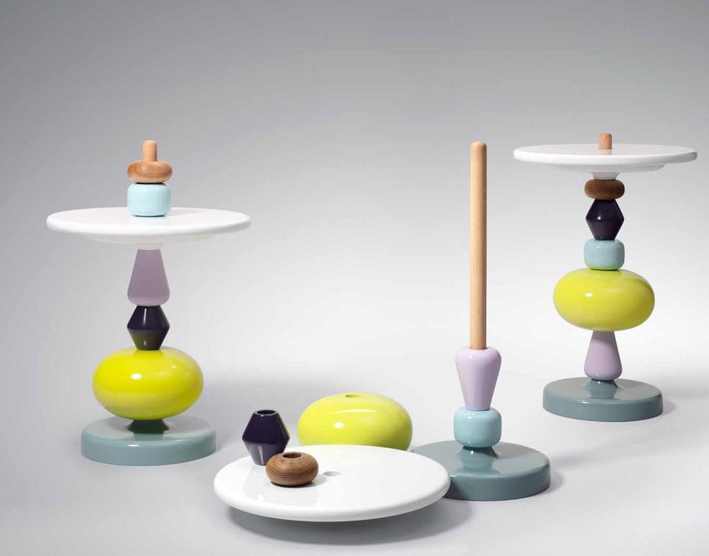 shuffle table by Mia Hamborg Mia Hamborg gives new life to the old Nordic craft tradition of turning wood by adding the colour and playful forms from old painted wooden toys.