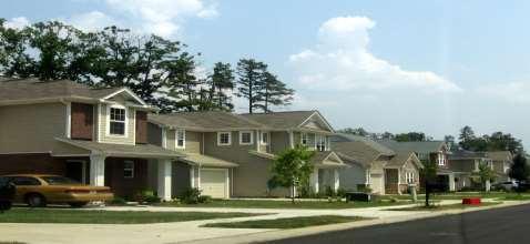 Suburban Definition Mixture of housing types and suburban densities, providing a transition from low-density rural communities to more intense high-density urban environments.