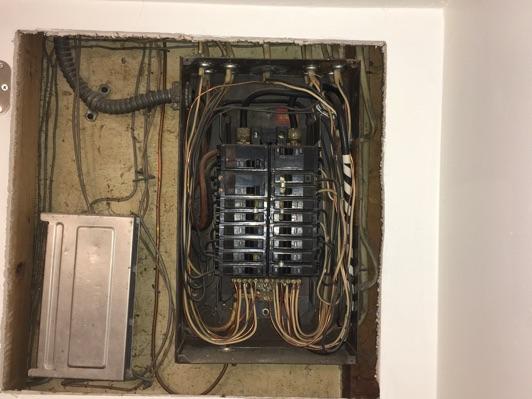 White neutral wires connected to circuit breakers should be black or red taped to designate they are hot, recommend further investigation and correction by licensed electrical contractor.
