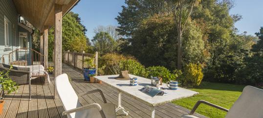 GARDENS Set back from the lane, hidden from view, and enjoying a high degree of privacy and all year round sun, with a southerly and westerly aspect, Keramos stands