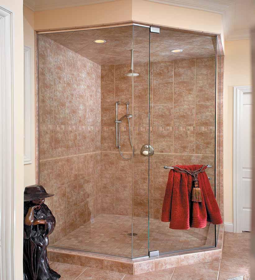 A traditional pull and towel bar set and prima hinges finished in satin chrome are featured on this elegant shower.