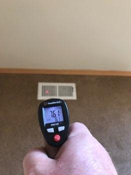 Flooring is carpet. Heat register present. Accessible outlets operate.