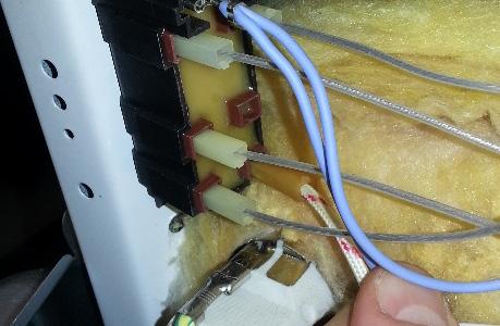 Install a new spark igniter by securing it in the holder using the wire clip.