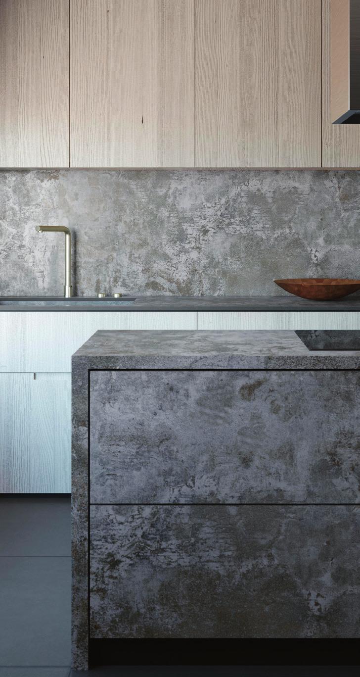 08 09 08 09 10 Caesarstone s cool, confident Rugged Concrete quartz countertop is marked by its rich gray base with cloud-shaped splotches of white.