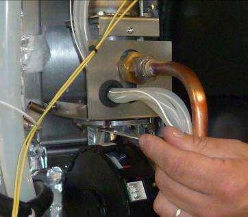 GAS BURNER Undo the 4 screws that fix the fan