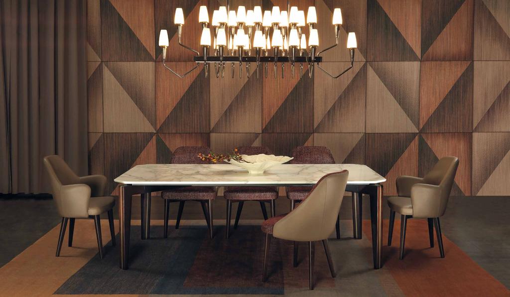 CURZIO A dining table with wood legs and a metal core which can be produced in numerous shapes and sizes.