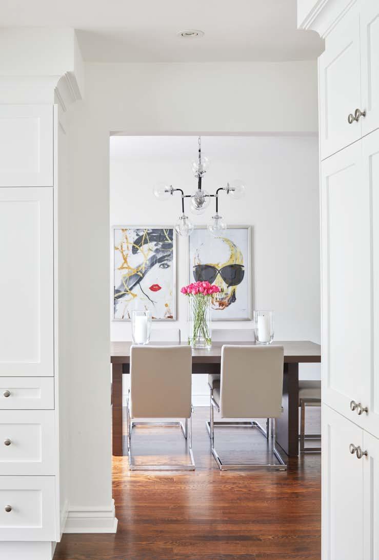 IT WAS IMPORTANT TO ME THAT THE VIBE OF THIS HOME REFLECT THE HOMEOWNERS PERSONALITIES, BOTH YOUNG AND ACTIVE PROFESSIONALS, SAYS TERRI. Dining room artwork ref lects the couple s playful side.