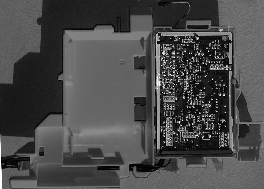 C. board from the control P.C. board holder. Photo 4 PHOTOS Control P.C. board holder (Inside) Catch Indoor electronic control P.C. board Catch Control P.C. board holder (Back side) Room temperature thermistor 4.