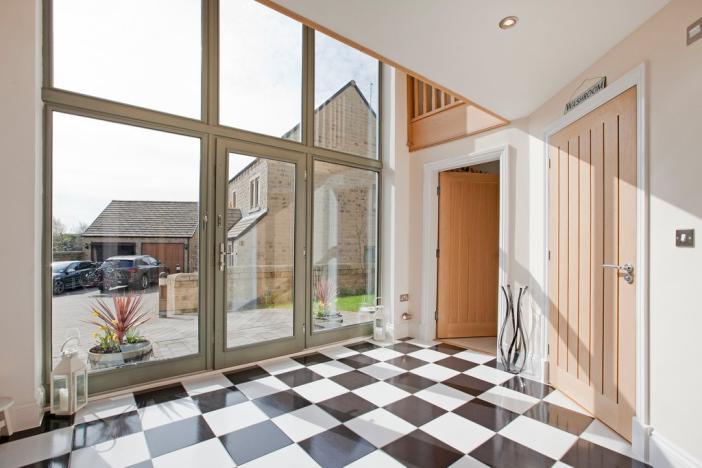 The versatile living space is perfect for a growing family and briefly comprises, a superb reception hall, large dining/living kitchen, cloakroom and utility room.