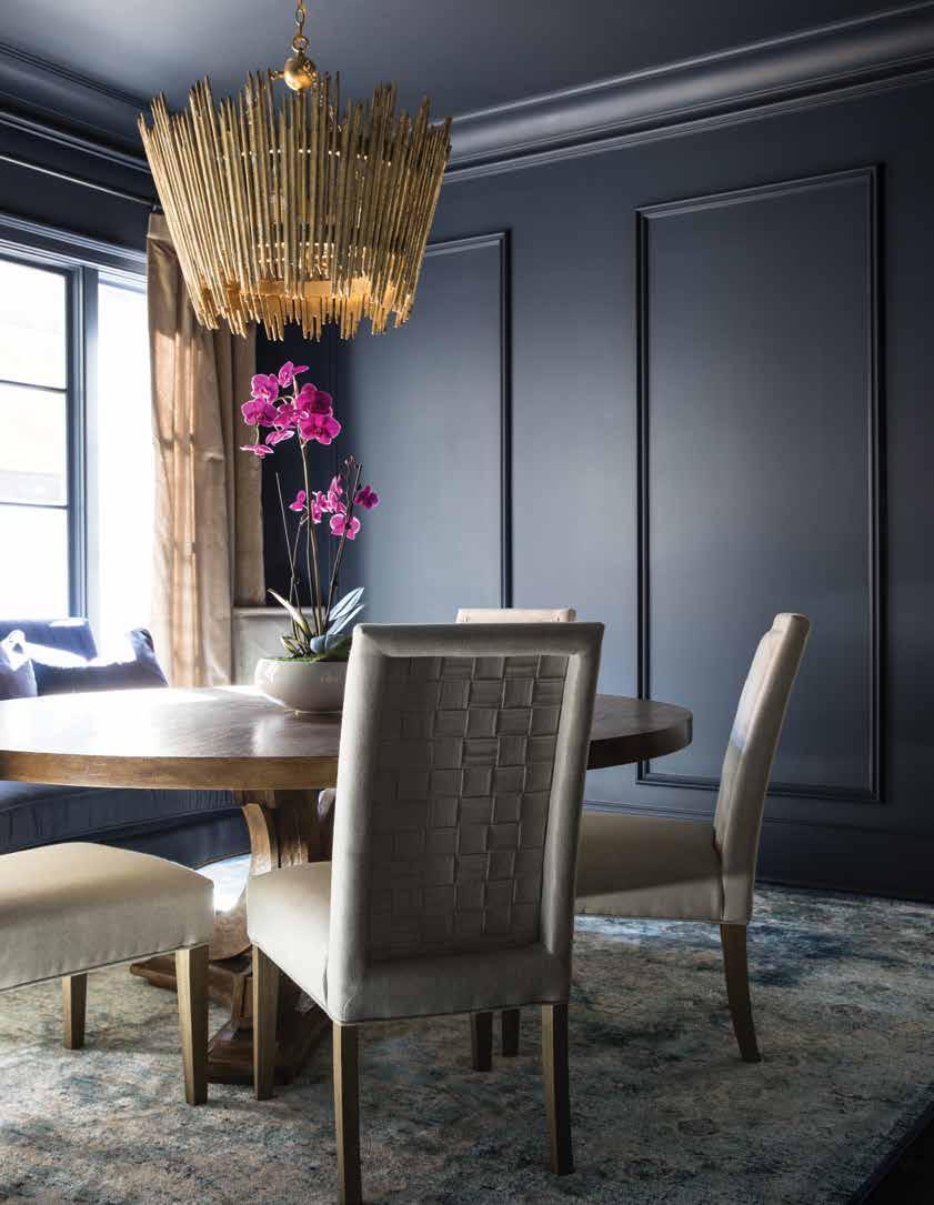 68 Home Design & Decor Charlotte April / May 2018 Benjamin Moore Hale Navy colors the walls of the dining room and provides an attractive