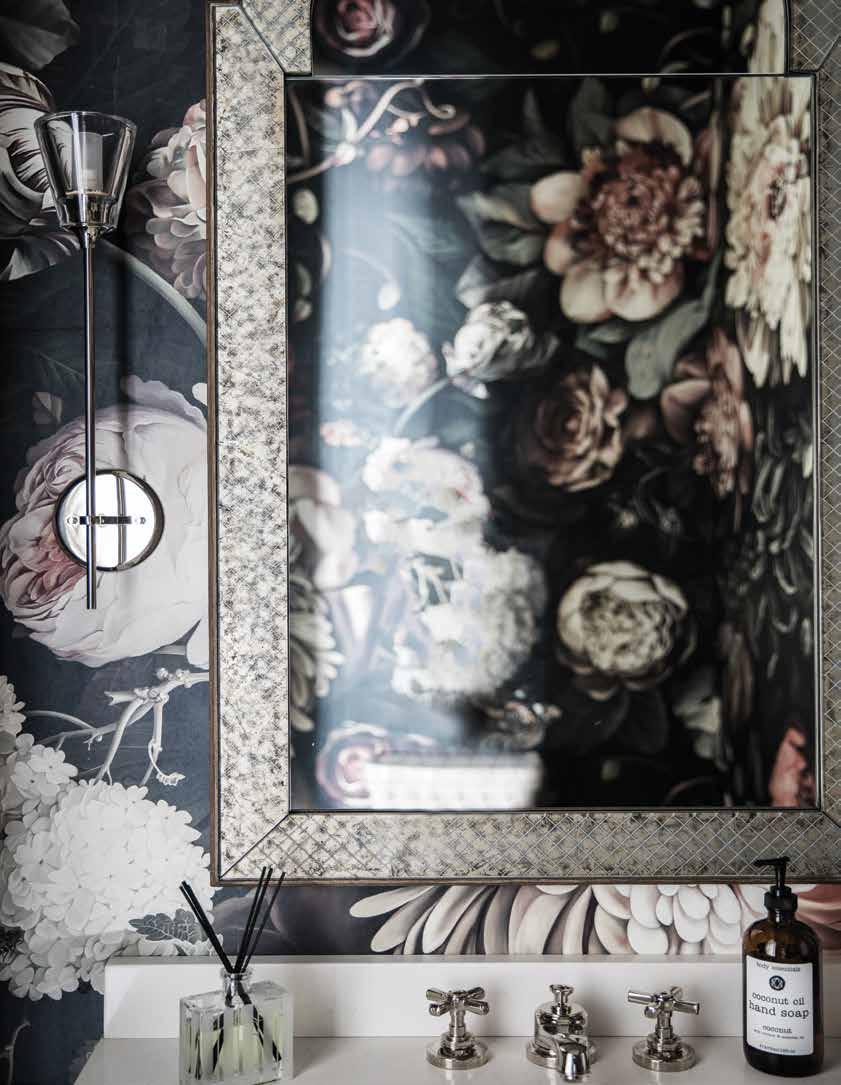 72 Home Design & Decor Charlotte April / May 2018 Floral wallcovering by UK designer Ellie Cashman completes the look of this moody powder room.
