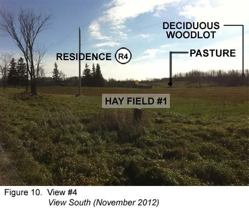 The entrance to Residence R3 is located directly across Heart Lake Road from Hay Field #1.