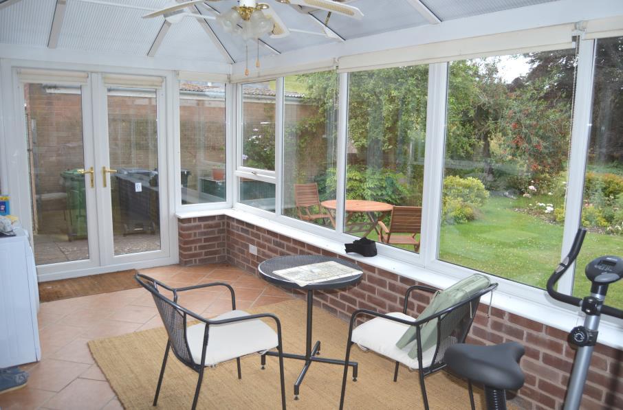 Conservatory: measuring approximately 9 0 x 18 0 (2.74m x 5.48m) constructed of brick with upvc glazed panels and polycarbonate roof. Opening vents and central fan with lights.