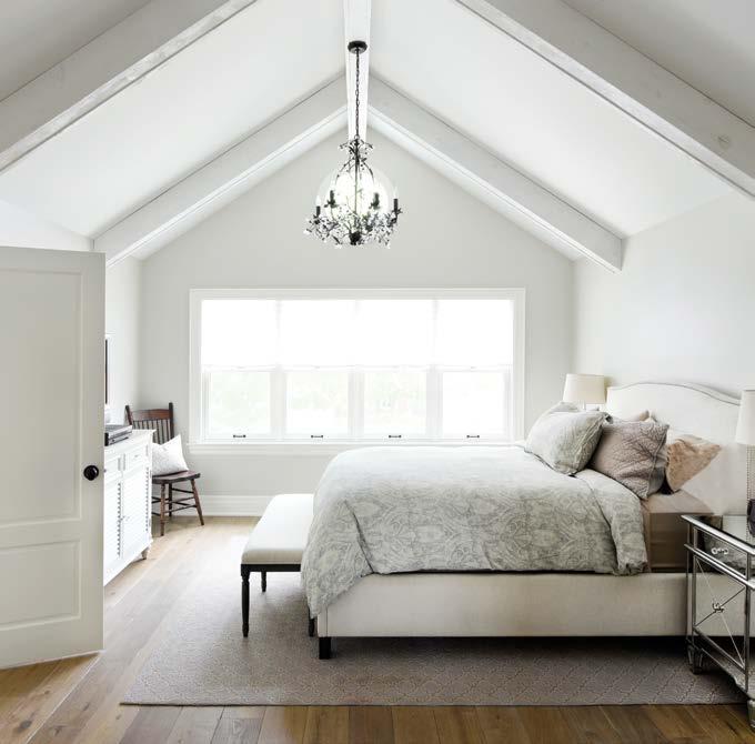 RIGHT: With clean lines and muted colours, the master bedroom is a