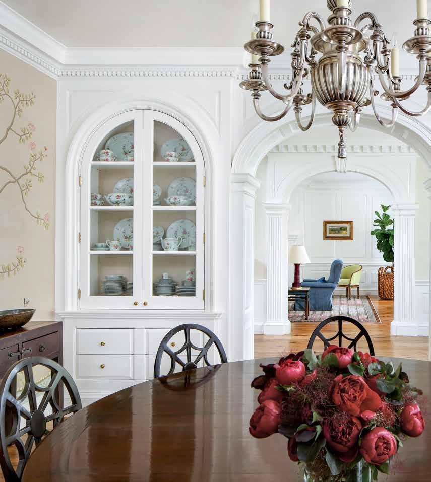 In each corner of the dining room, Buergler designed built-in cabinets, which hold the owners collected tableware.