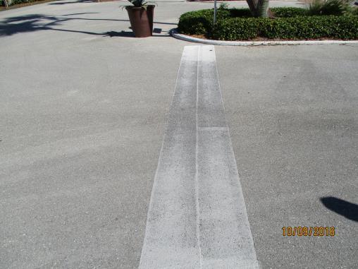 Crosswalk lines and bike path lines are fading