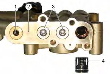 6.5.7 Remove the high pressure valves. The high pressure valves are secured with a support plate and one lock cap each.