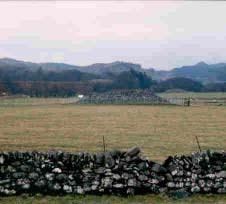 Aerial view of the cairns in 1977. Linear cairns A group of three, formerly four, Neolithic/Bronze age cairns, extend down the centre of Kilmartin Glen.