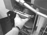 3-15. PREVENTIVE MAINTENANCE (CONT.) LUBRICATING LID ROLLERS - ANNUALLY The lid rollers, in the back of the fryer, should be lubricated at least once a year, to allow the lid easy movement. 1.