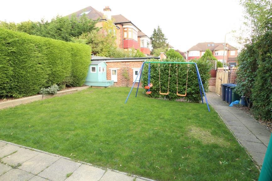 23m), mainly laid to lawn with initial paved patio area, decking area to side with access ramp