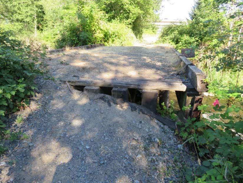 Existing Bear Creek bridge, facing southeast (Photographed on July 14, 2017) To accommodate stormwater discharges, two new outfalls would be needed to convey stormwater from the guideway to the
