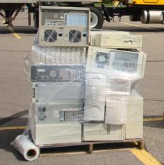 Protect laptops with separate cardboard boxes, and put them with the computers. Apply enough layers of shrink wrap to ensure the CEDs will not topple over when transported.