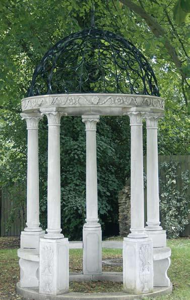 The Park Temple [item 61a] Hand carved from natural limestone, the wrought iron domed roof, with spear finial rests upon a highly decorated frieze having carved ribbon floral swags and shields.
