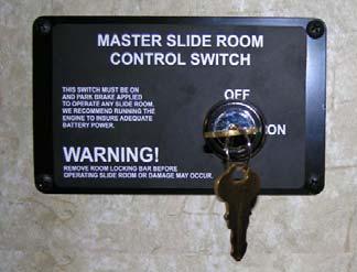 SECTION 10 SLIDEOUT ROOMS AND LEVELING Master Keylock A master keylock switch is located near the power switch for the front slideout room.