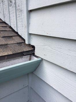 2. Flashing Return flashing not installed where roof butts into siding above gutters.